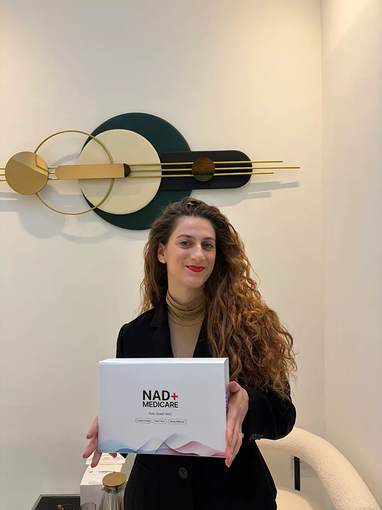 NAD+ Medicare team member holding an NAD+ Medicare kit box